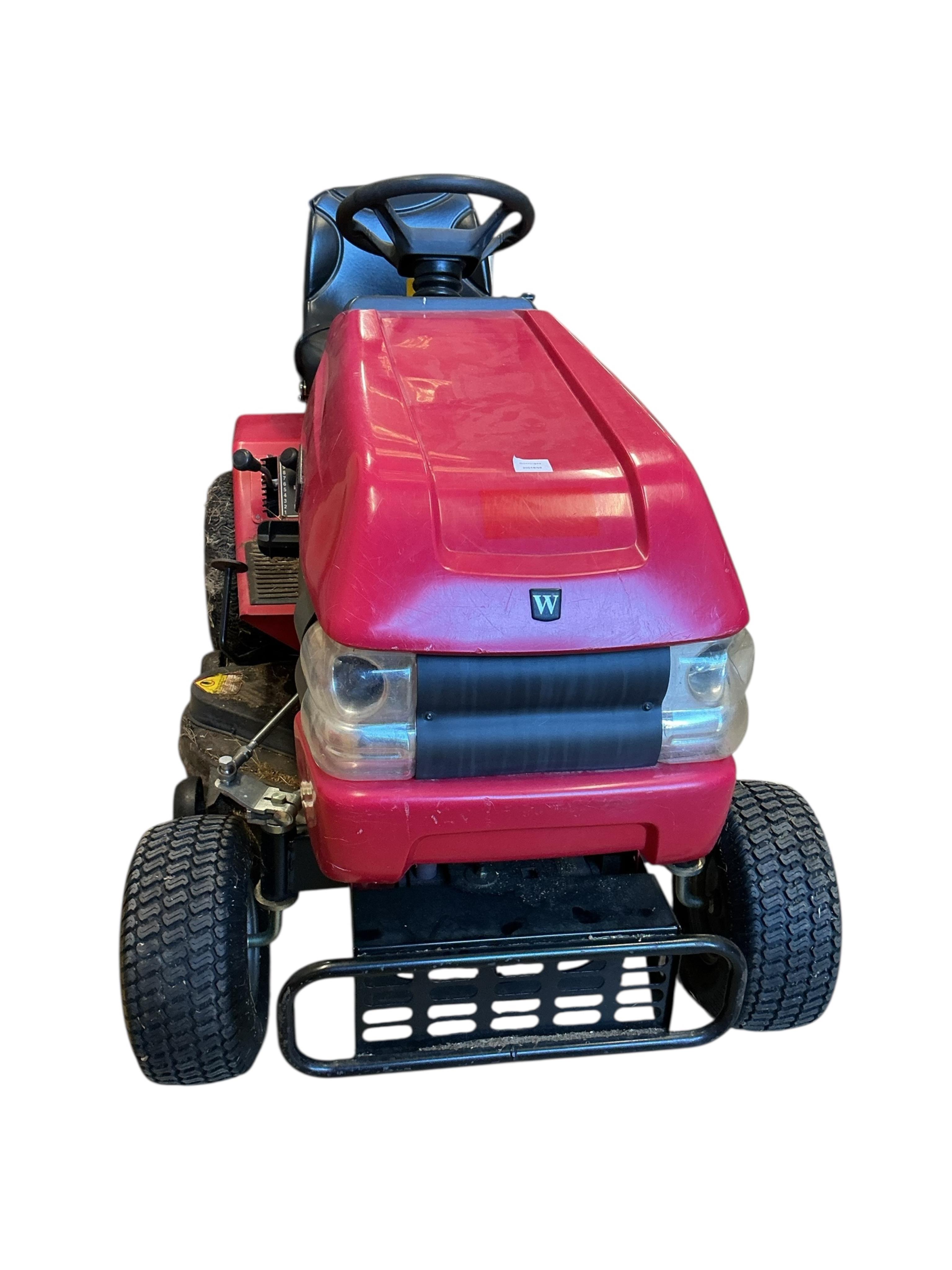 A Westwood S1300 ride on mower with scarifier and brass box attachments